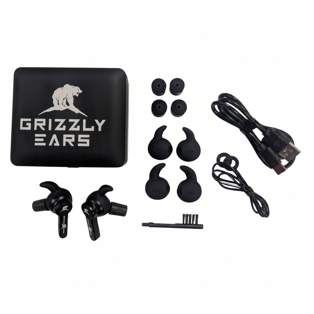 Contenuto confezione Grizzly Ears APEX: auricolari, custodia, tappi silicone, cavo USB-C, spazzola